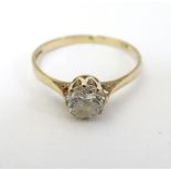 A 9ct gold ring set with white stone solitaire CONDITION: Please Note - we do not