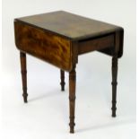 A 19thC mahogany pembroke table with a single end drawer and standing on four turned tapering legs.
