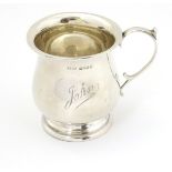A silver Christening mug hallmarked Birmingham 1933 maker Mason & Jones.