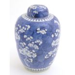 A Chinese blue and white ginger jar and cover with prunus blossom decoration.