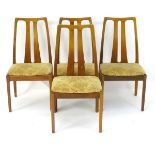 Vintage Retro: A set of four teak dining chairs with slatted back rests and the chairs raised on
