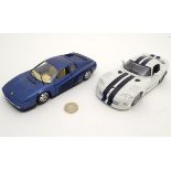 Toys: A Burago 1:24 scale dark blue Ferrari testarossa model car,