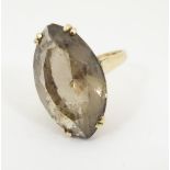 A vintage retro 9ct gold ring set with large marquise cut smoky quartz. London c.