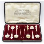 A cased set of 6 'King Edward VII Souvenir' spoons with sugar tongs en suite.