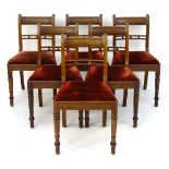 A set of six mahogany dining chairs with incised top rails and unusual mid rails above drop in