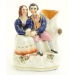 A Victorian Staffordshire pottery flatback spill vase depicting Victoria and Albert seated. Approx.