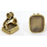 A 19thC yellow metal pendant fob seal with engraved rock crystal armorial seal under.