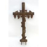 A large cast iron memorial / religious cross moulded to look wooden,