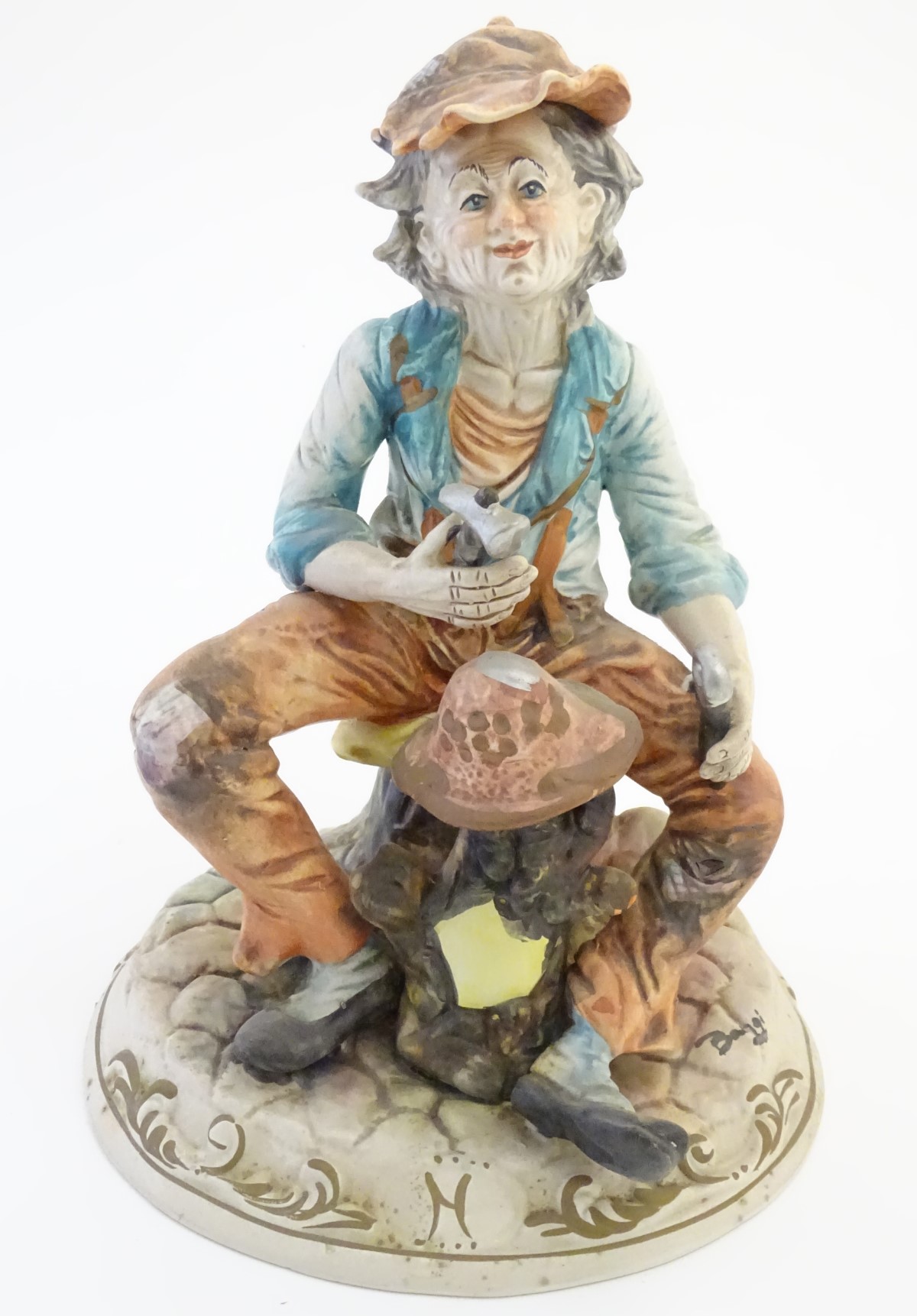 A Capodimonte figure of an elderly man with tools, possibly an armourer. - Image 3 of 7