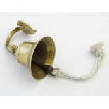 Nauticalia: A 20thC brass ship's bell with banded decoration. Made by Lowe, England, marked within.