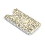 A silver card case with embossed decoration hallmarked Chester 1911 maker AW.