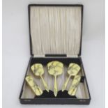 A cased vintage retro dressing table brush and mirror set, with late Deco and oriental styling,