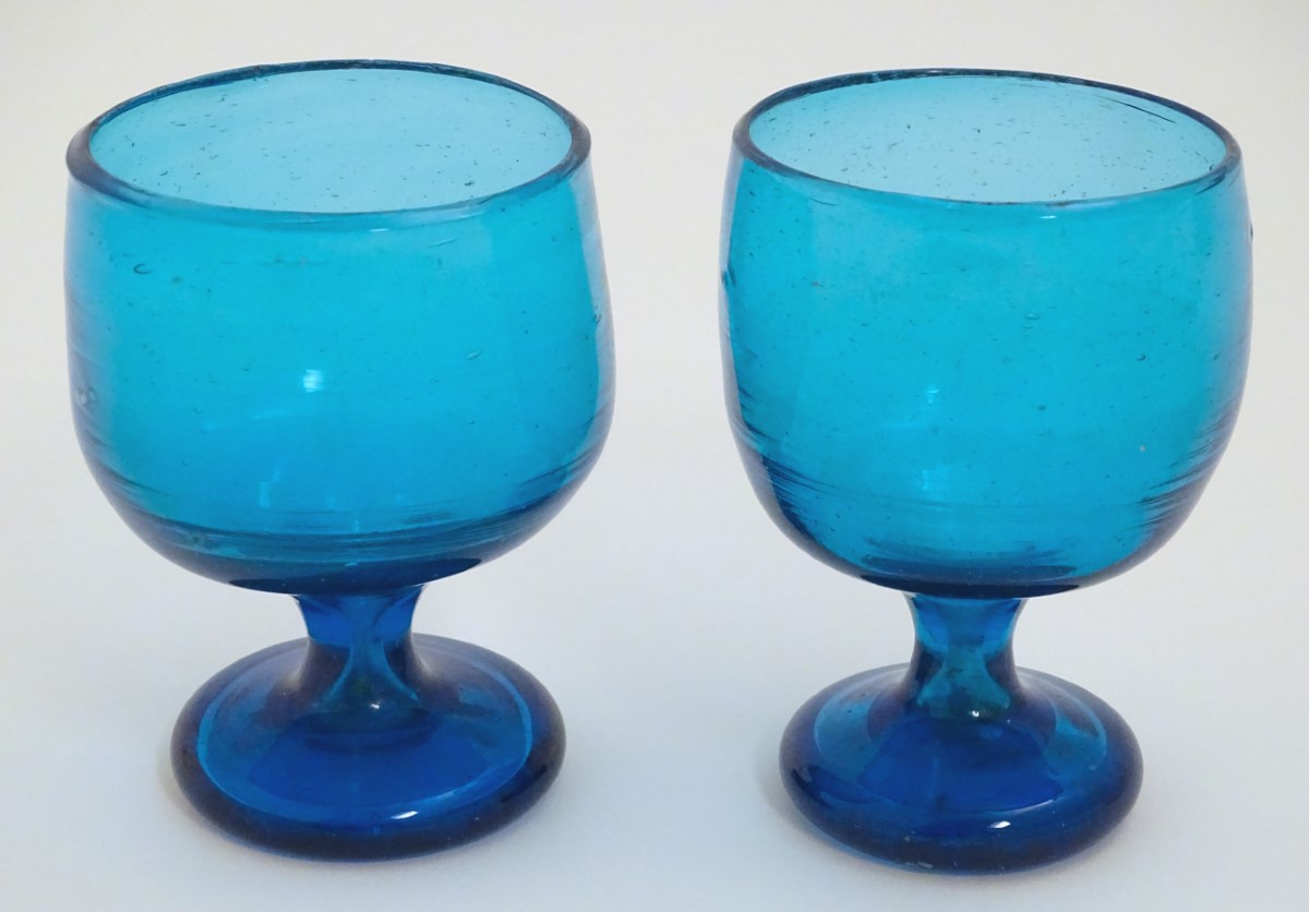 Two 19thC turquoise soda glass pedestal drinking glasses. Approx. 5" high.