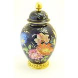 A Rosenthal lidded pot / ginger jar with hand painted floral decoration and gilt highlights.