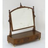 An early 19thC mahogany toilet mirror / dressing mirror with decorative stringing to the surround