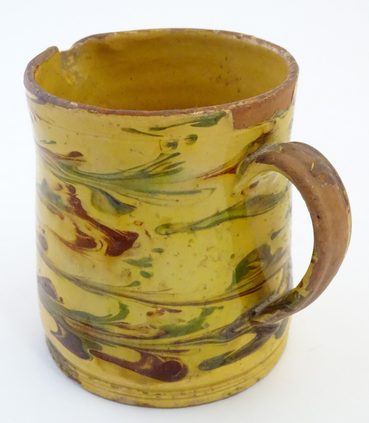 A 19thC studio pottery slipware jug with a yellow ground. Indistinct incised mark under. Approx. - Image 5 of 7