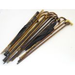 A collection of sticks, canes and umbrellas, variously of Mallaca, beech,
