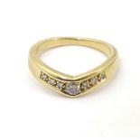 An 18ct gold ring set with diamonds in a wishbone setting CONDITION: Please Note