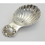A silver caddy spoon with shell formed bowl hallmarked Birmingham 1976 maker Albert Edward Jones.
