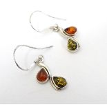 Silver earrings set with amber drops. Approx 1 ½" long.