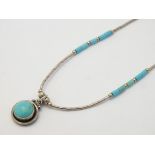 A silver necklace set with turquoise detail in the Zuni / Navajo style approx 15" long