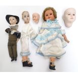 Toys: A 20thC doll with a painted bisque socket head, blinking eyes, an open mouth,