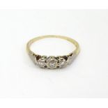 An 18ct gold ring set with trio of diamonds CONDITION: Please Note - we do not