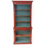 A mid 19thC mahogany chiffonier bookcase with a moulded cornice above four shelves flanked by