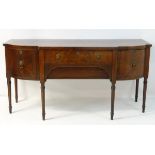 A late 19thC / early 20thC mahogany sideboard with a break front top,
