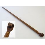 An early 20thC Pitcairn Island folk art walking stick, of native hardwood construction,
