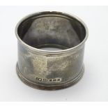 A silver napkin ring hallmarked London 1934 maker JWB Ltd.