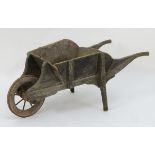 A late 19thC small wheelbarrow, of pine construction with painted finish, marked 'W.R.G.C.
