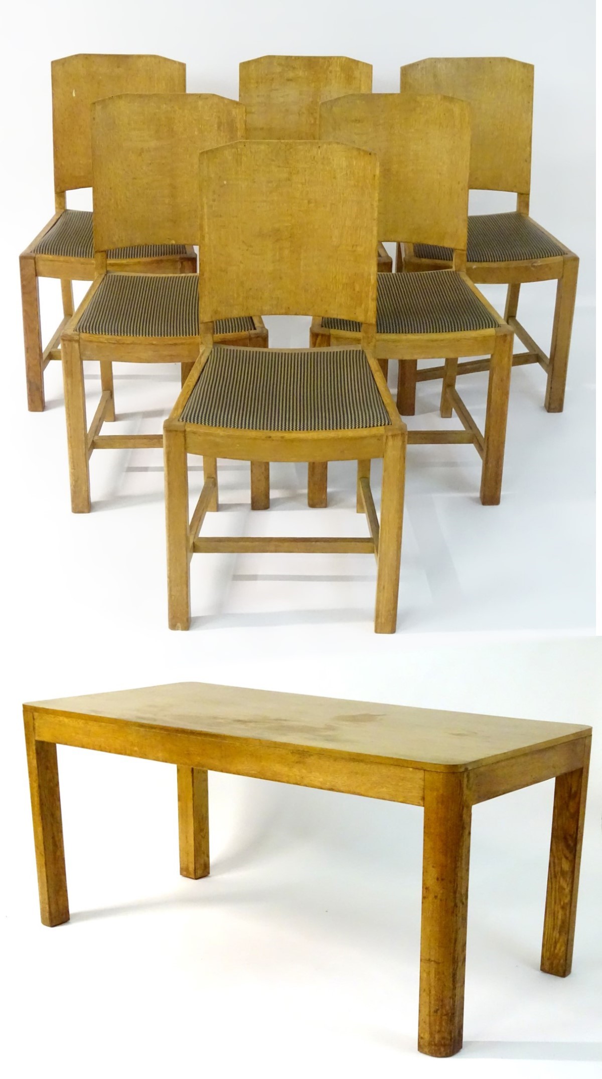 An Art Deco dining table and six matching chairs, of oak construction with light finish.