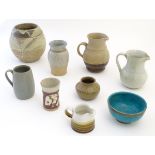 A quantity of assorted studio pottery wares to include jugs, vases and bowls.