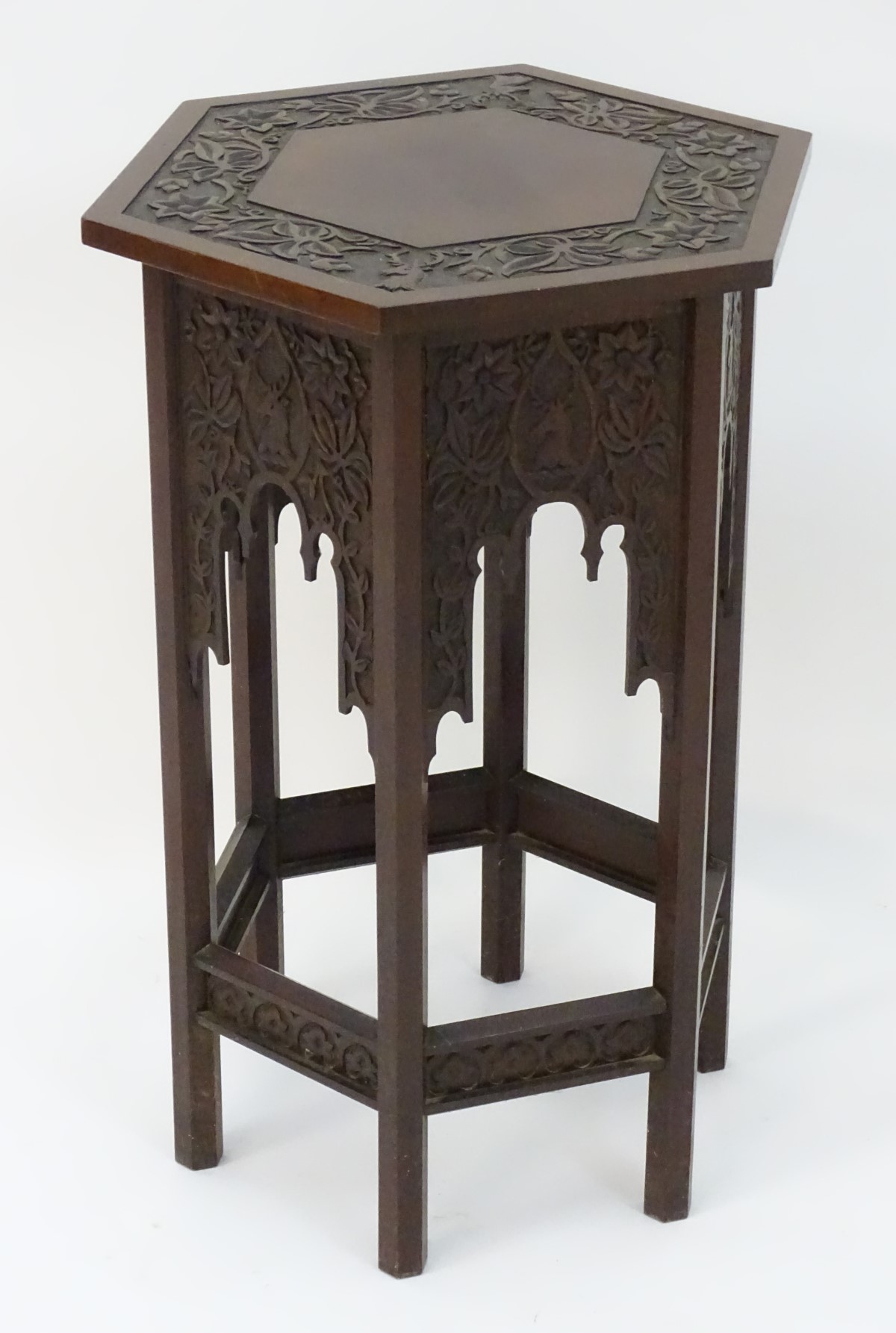 A walnut Liberty style table with a hexagonal carved top above six matching carved facades with - Image 10 of 13