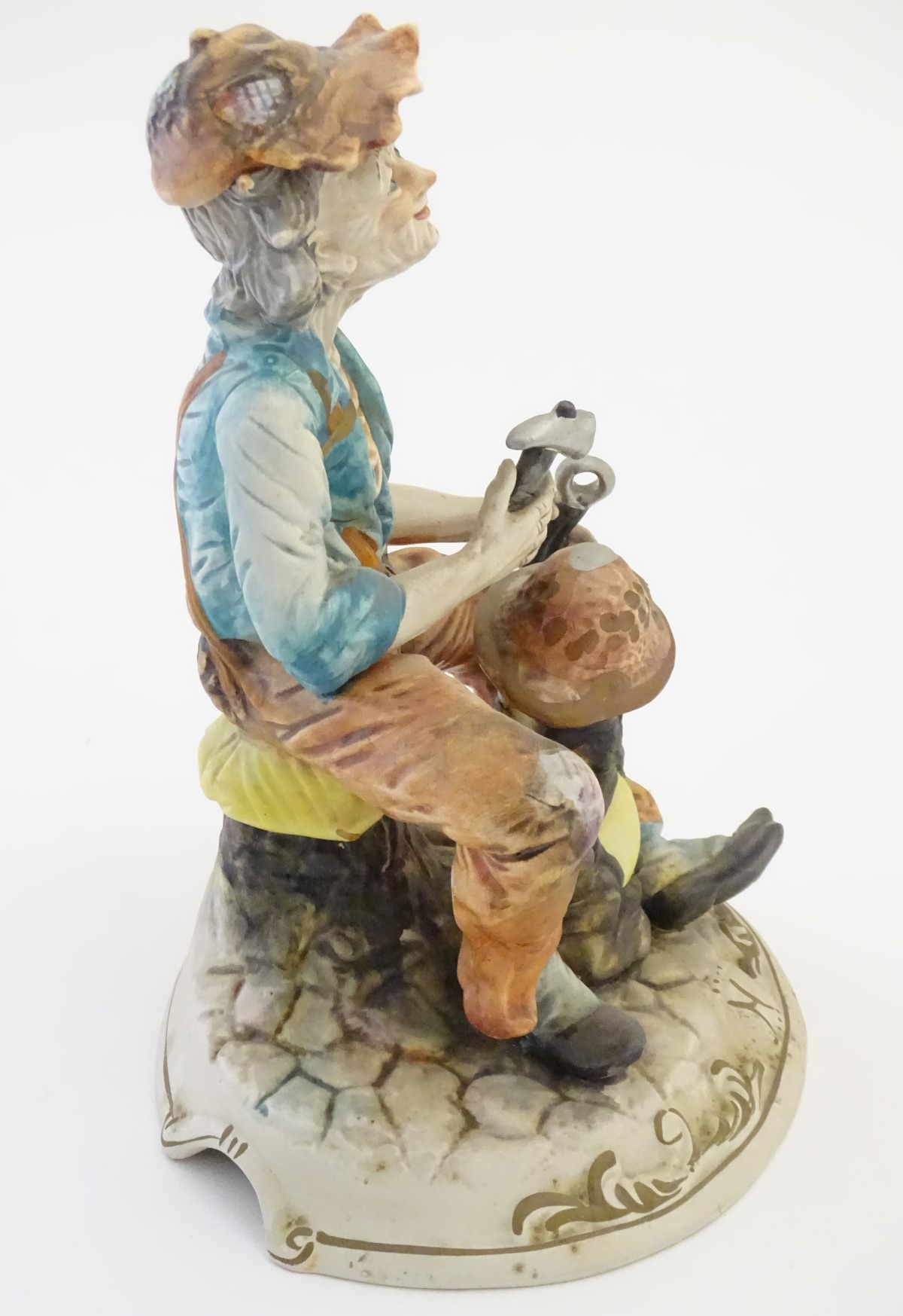 A Capodimonte figure of an elderly man with tools, possibly an armourer. - Image 6 of 7
