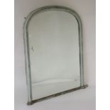 A late 19thC painted arch topped mirror.