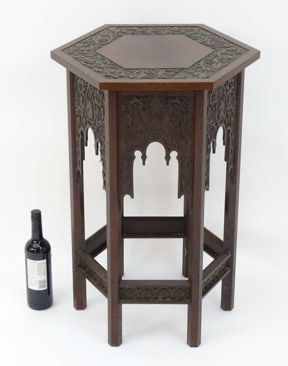 A walnut Liberty style table with a hexagonal carved top above six matching carved facades with - Image 4 of 13