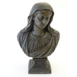 A 20thC cast metal bust of the Virgin Mary, Our Lady of Sorrows, raised on a square,