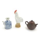 Three Chinese ceramic items comprising a Yixing clay teapot,