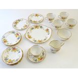 A quantity of Royal Albert tea wares decorated with scrolling flowers and foliage.