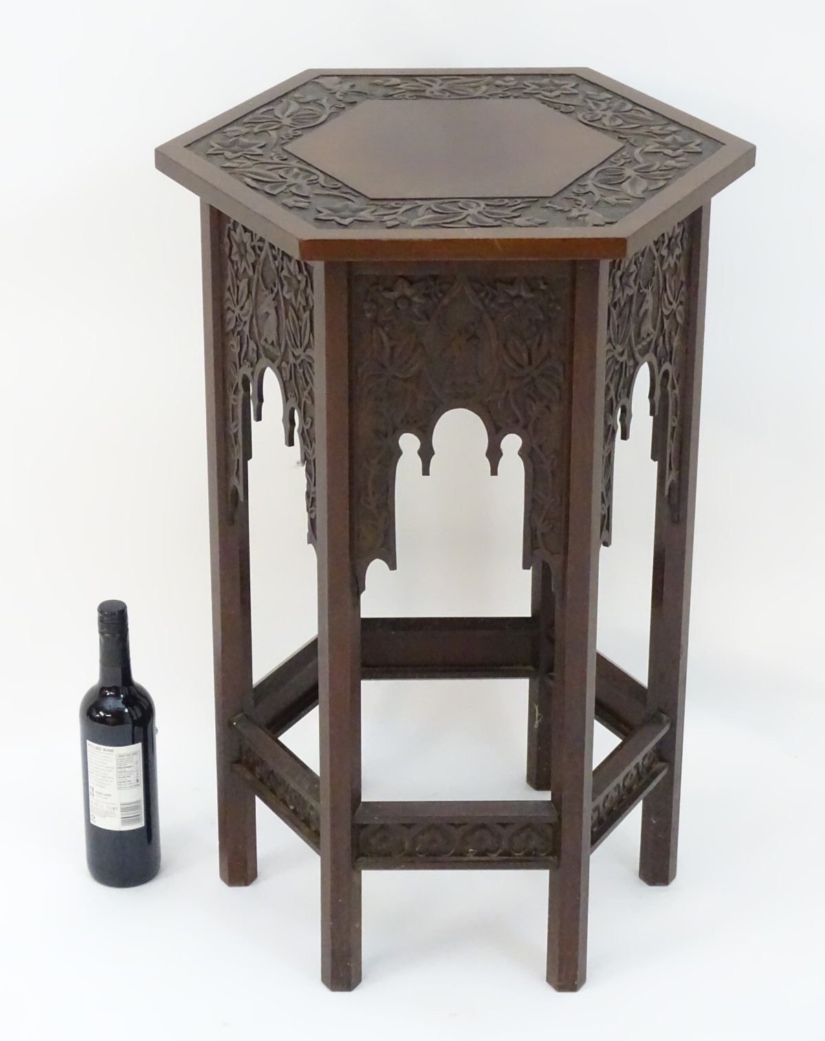 A walnut Liberty style table with a hexagonal carved top above six matching carved facades with - Image 2 of 13