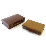A leather attache case of rectangular form, marked Real Cowhide. Together with another.
