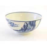 A Chinese blue and white bowl depicting scenes of figures in landscapes,