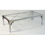 Vintage Retro mid Century modern: A large chromed and glass topped coffee table with cross bracing,
