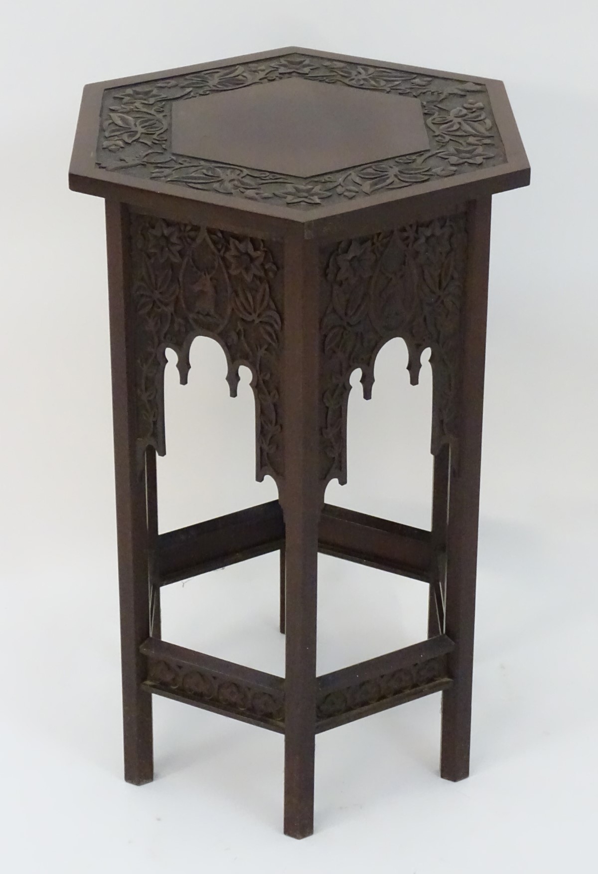 A walnut Liberty style table with a hexagonal carved top above six matching carved facades with - Image 11 of 13