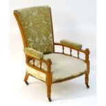 A late 19thC Aesthetic movement satinwood open armchair attributed to E.