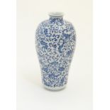 A Chinese blue and white 'Plum' vase decorated with scrolling foliage. Character marks under.