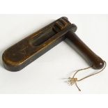 A 20thC wooden football rattle clacker / bird scarer. Approx. 9” high x 10 ½” wide.