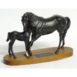 A Beswick model of Black Beauty and Foal raised on an oval wooden plinth from the Connoisseur